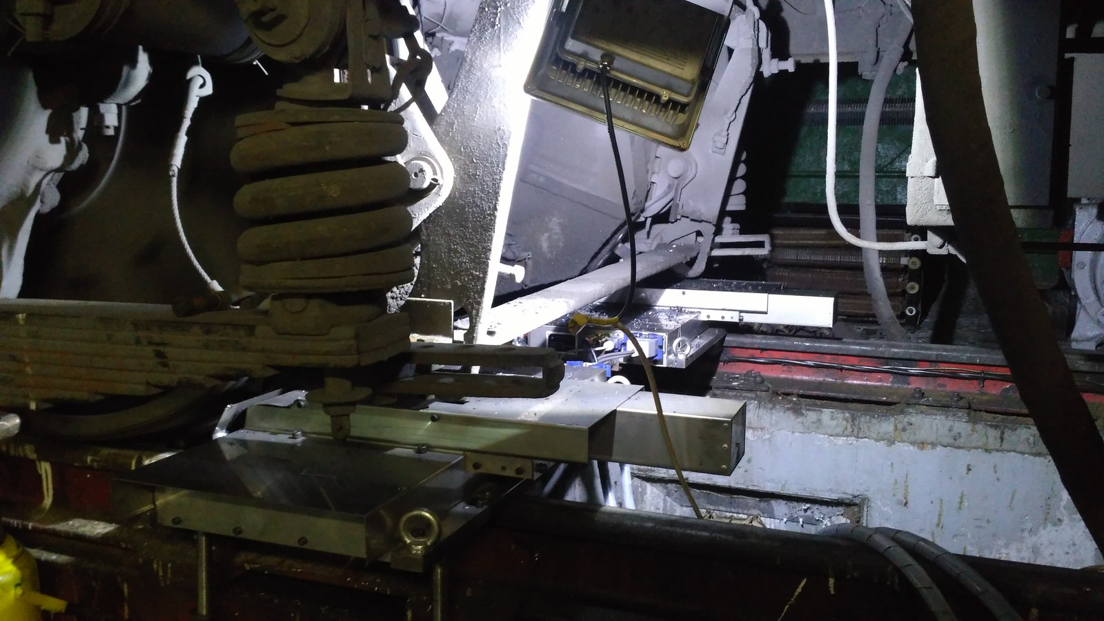 Mobile CNC wheel lathe during another turning operation in a depot