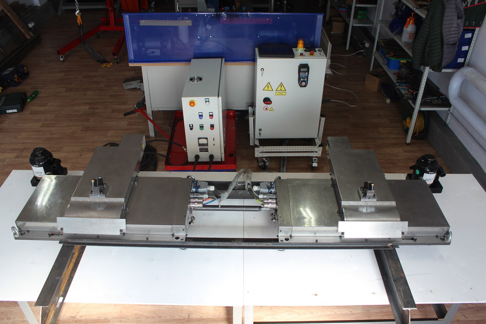 Assembly of two supports of the mobile CNC wheel lathe in the workshop